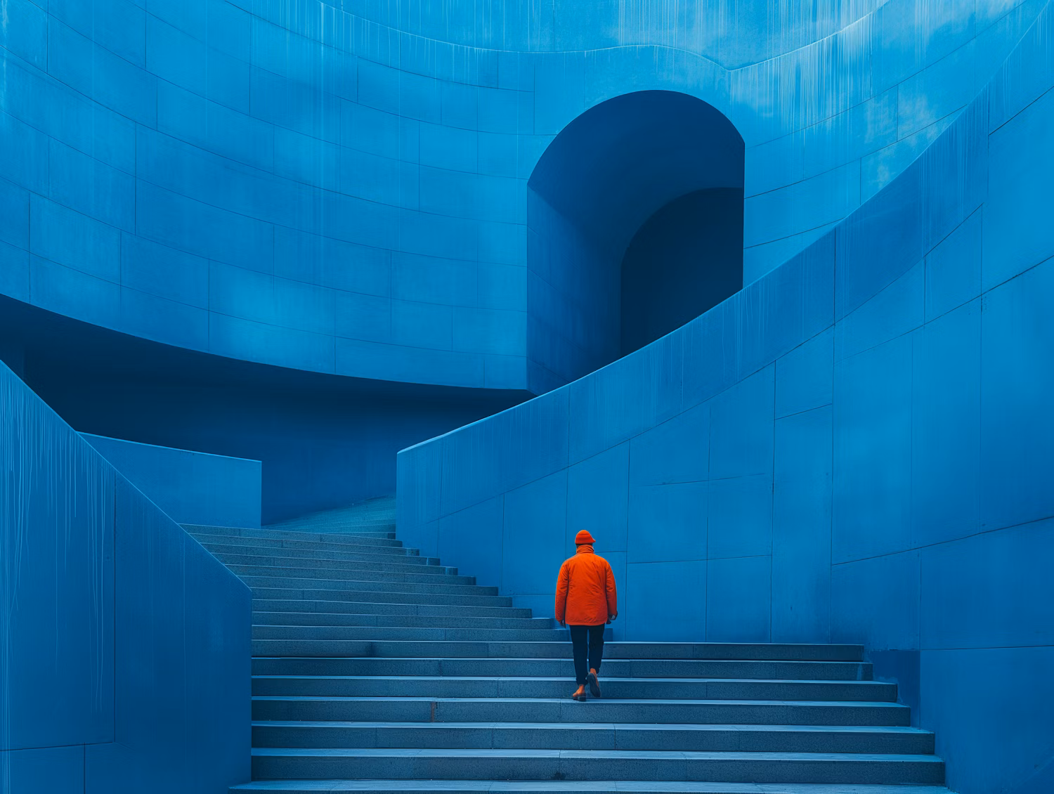 Person Climbing Blue Staircase